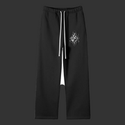 Veil Pants in black heavyweight fleece, featuring a straight-leg fit, white drawstring and flame artwork
